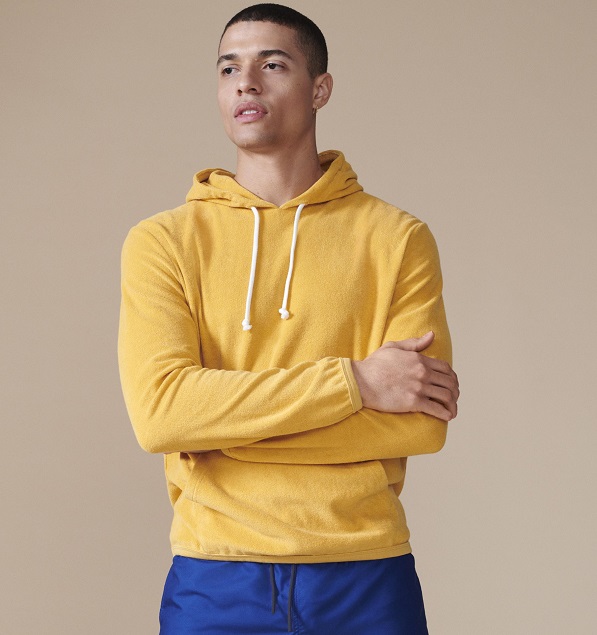 A model wearing yellow hoodie